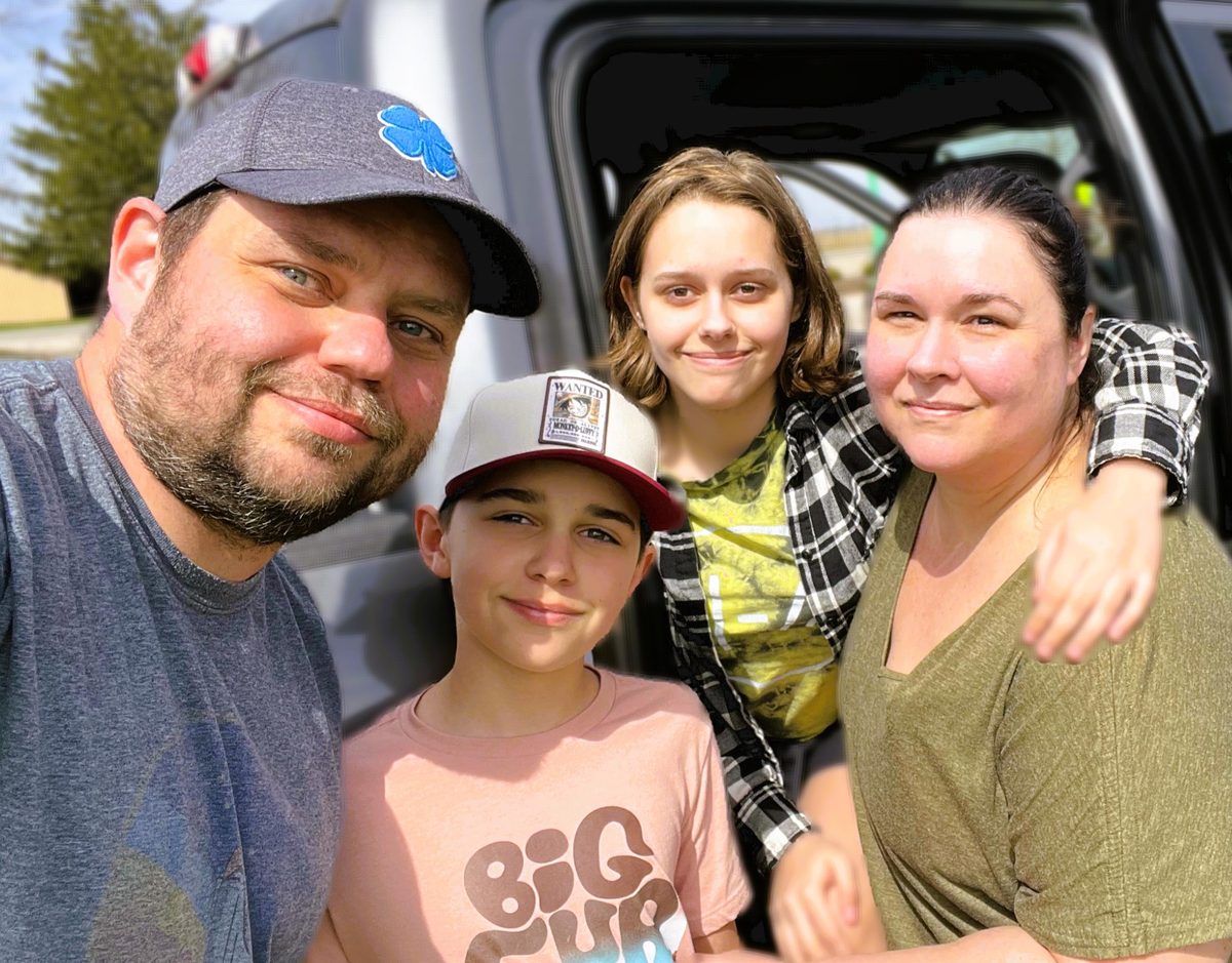 The four of us together beside the truck on eclipse day in Indiana, 2024